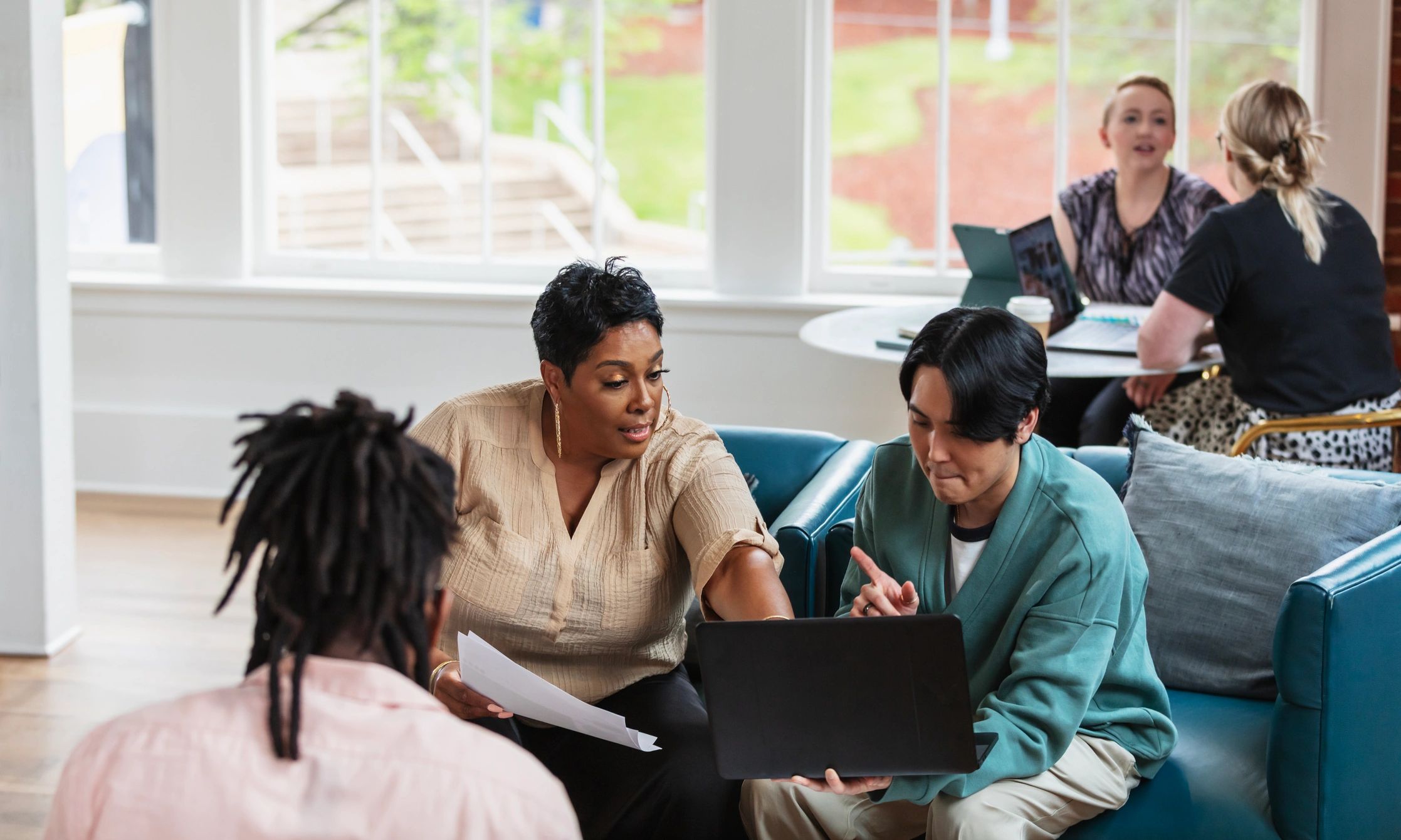 People collaborating in a shared workspace
